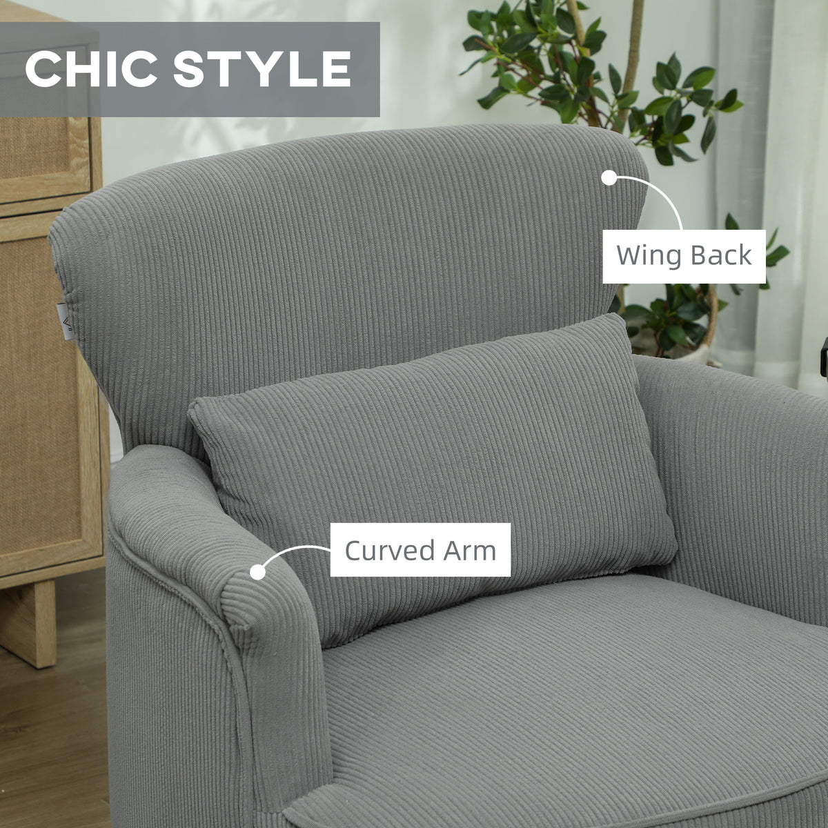 Close view of the chair's corduroy wing back, curved arm, and lumbar pillow