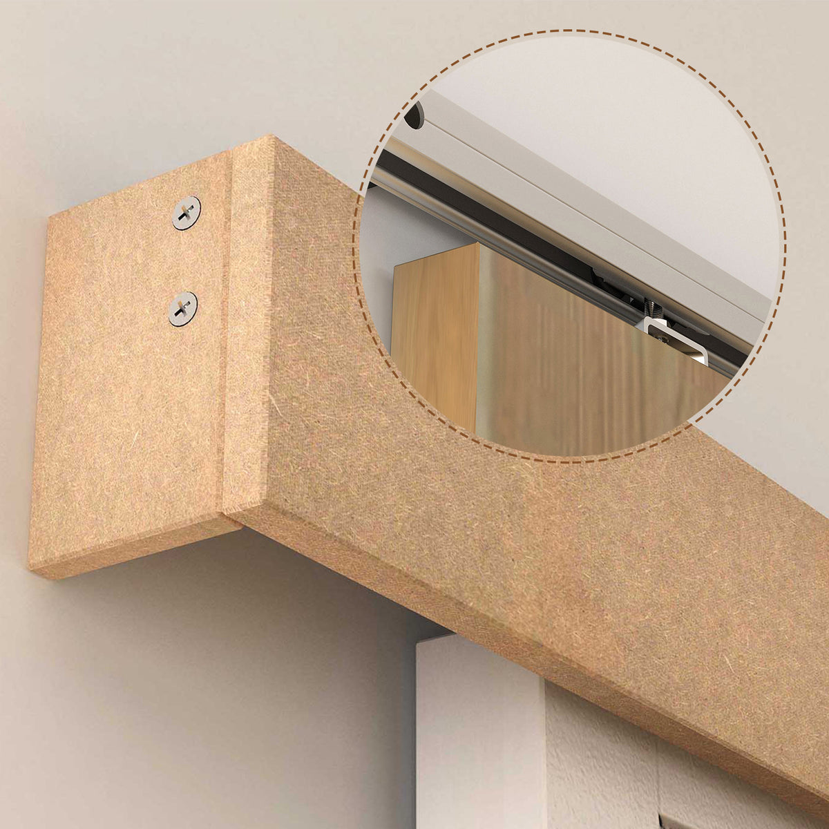 Close-up of a wooden door header with the sliding track mounted beneath it