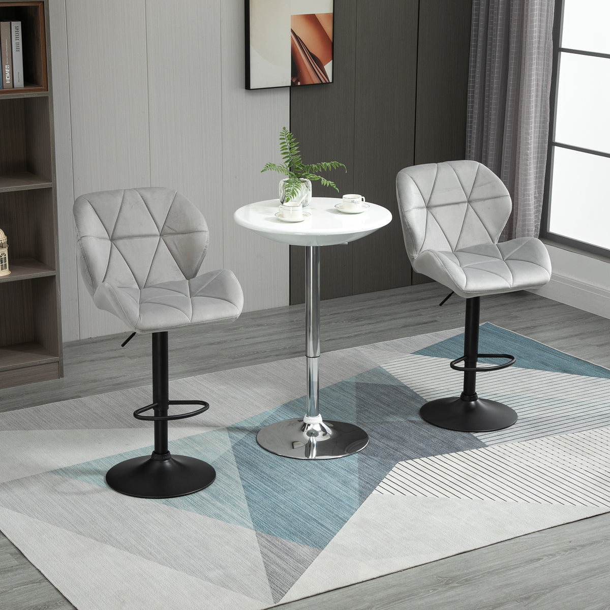 Pair of light gray velvet-touch bar stools with tufted seats and black metal bases