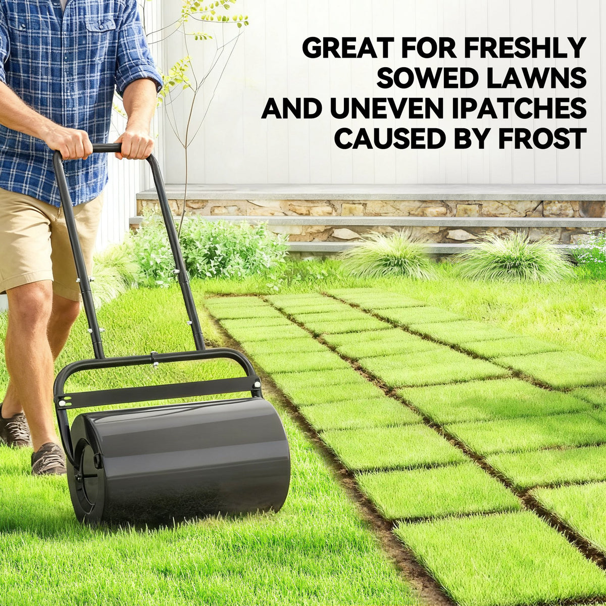 Black lawn roller pressing freshly laid grass with a U-shaped handle