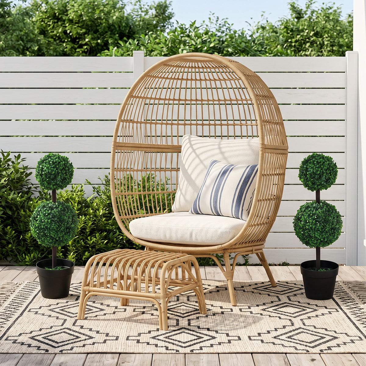 Outsunny artificial boxwood topiaries in black pots, shown as a pair beside outdoor seating