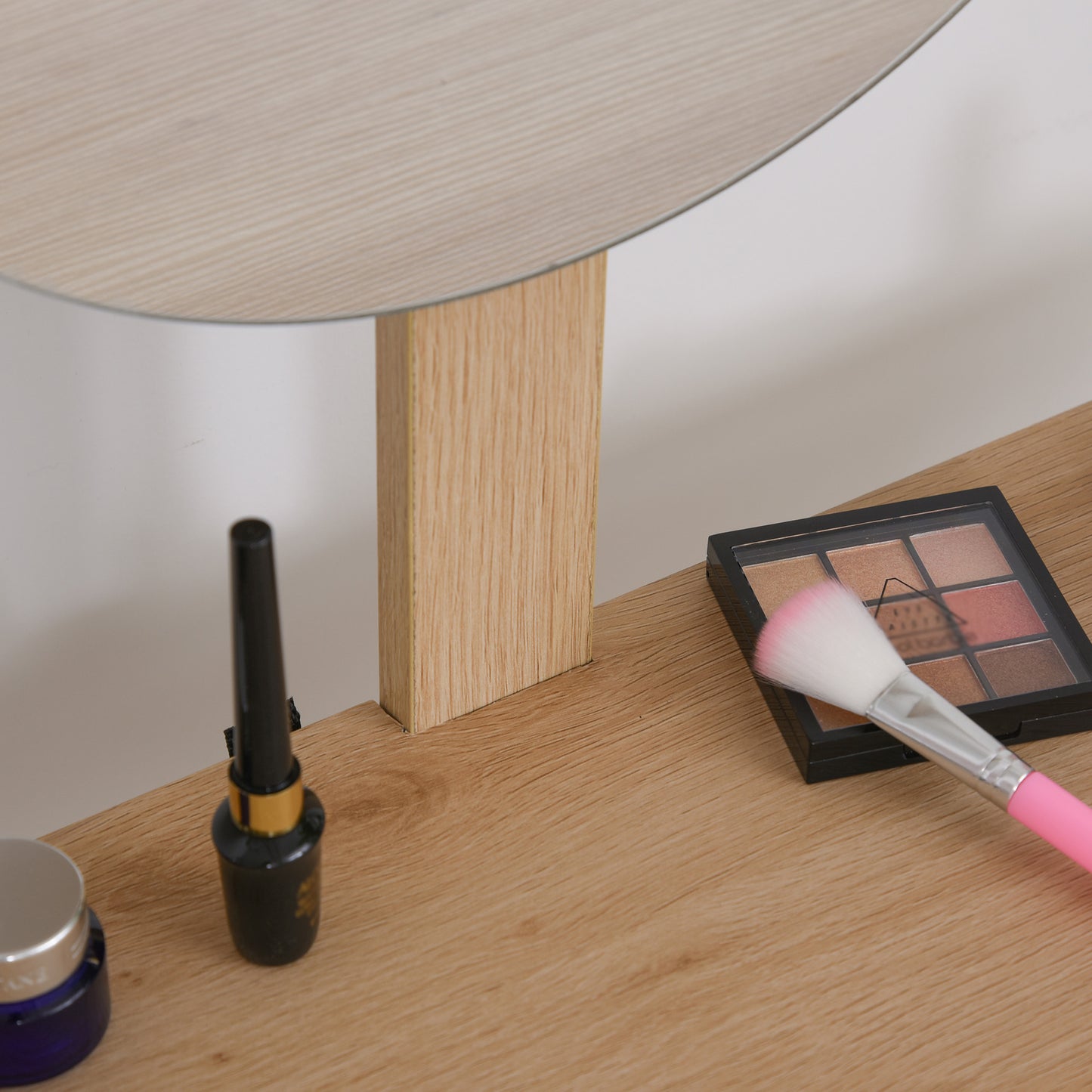 Close-up of the oak-finish dressing table top and mirror support.