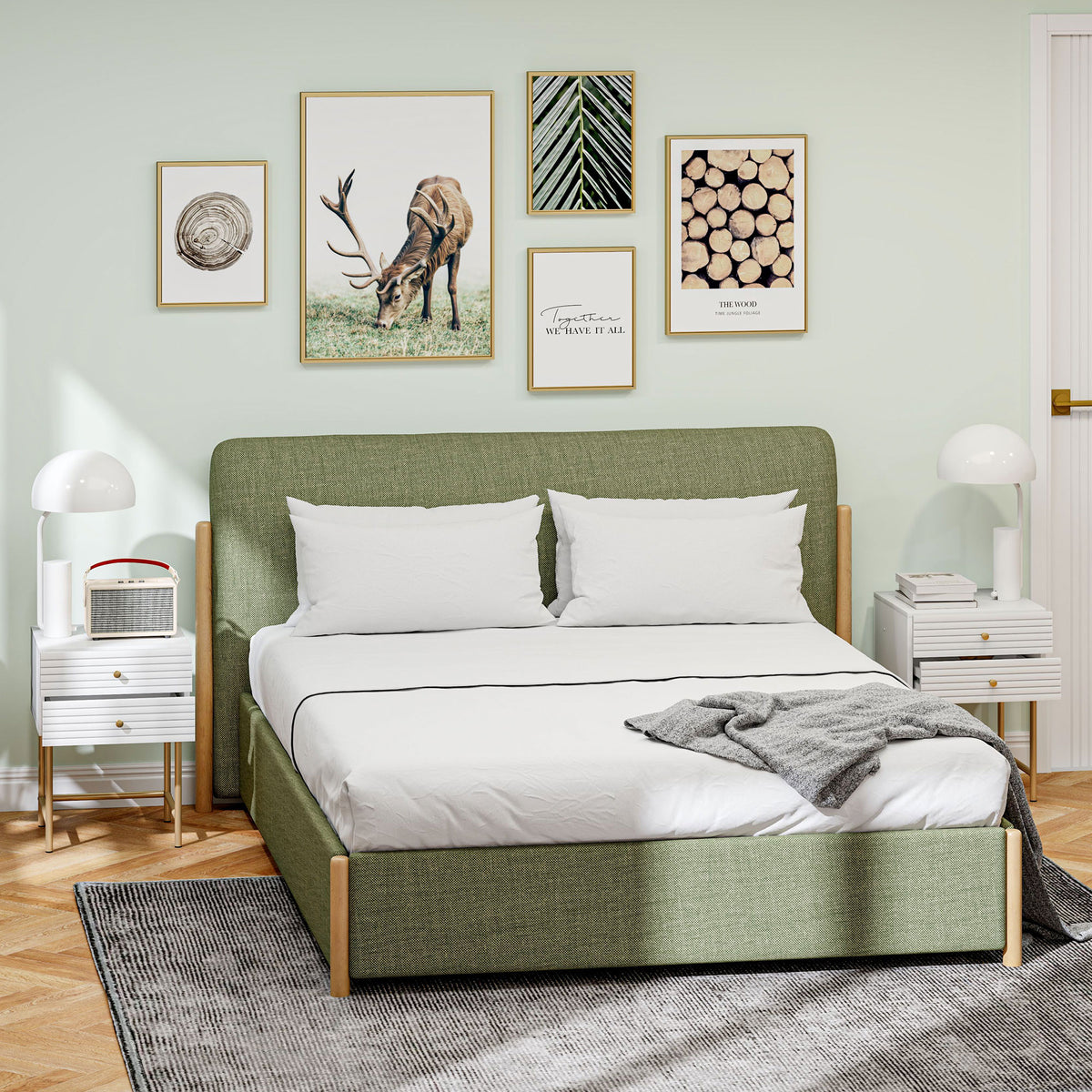 White two-drawer bedside tables with gold-tone legs, placed on either side of a bed