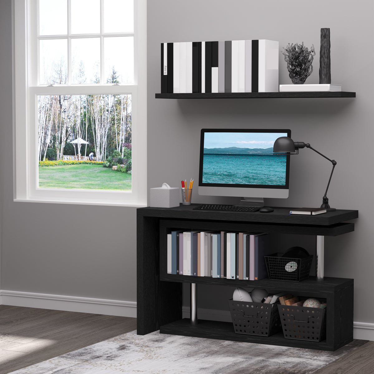 Black computer desk with two open storage shelves, books, and baskets.