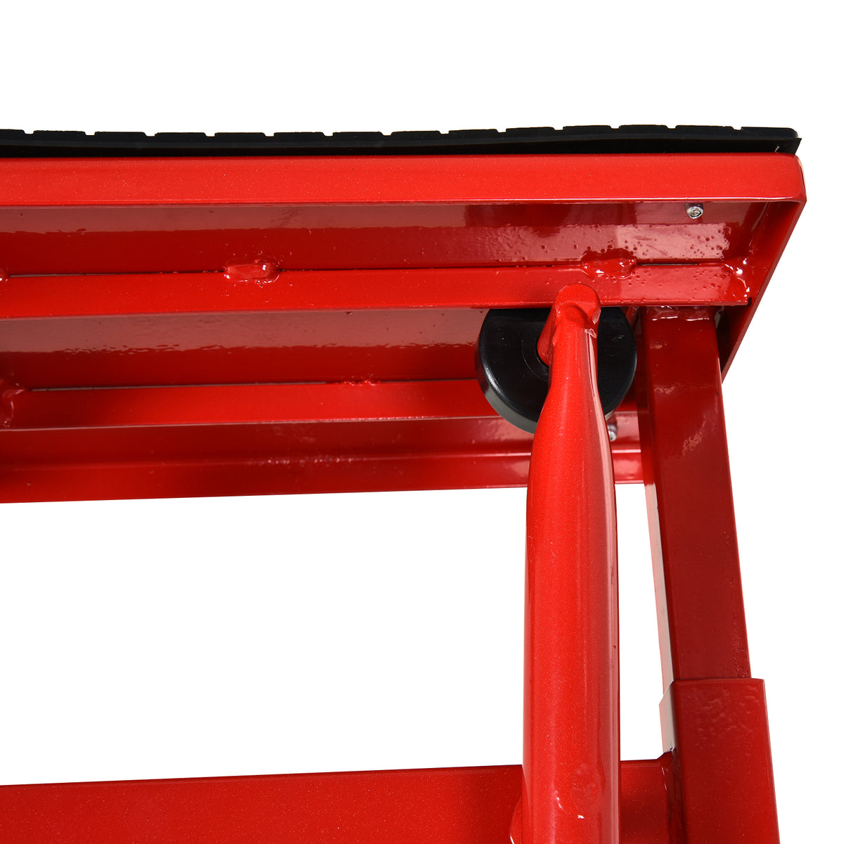 Close-up of the red motorbike lift's underside, frame, and crank mechanism.