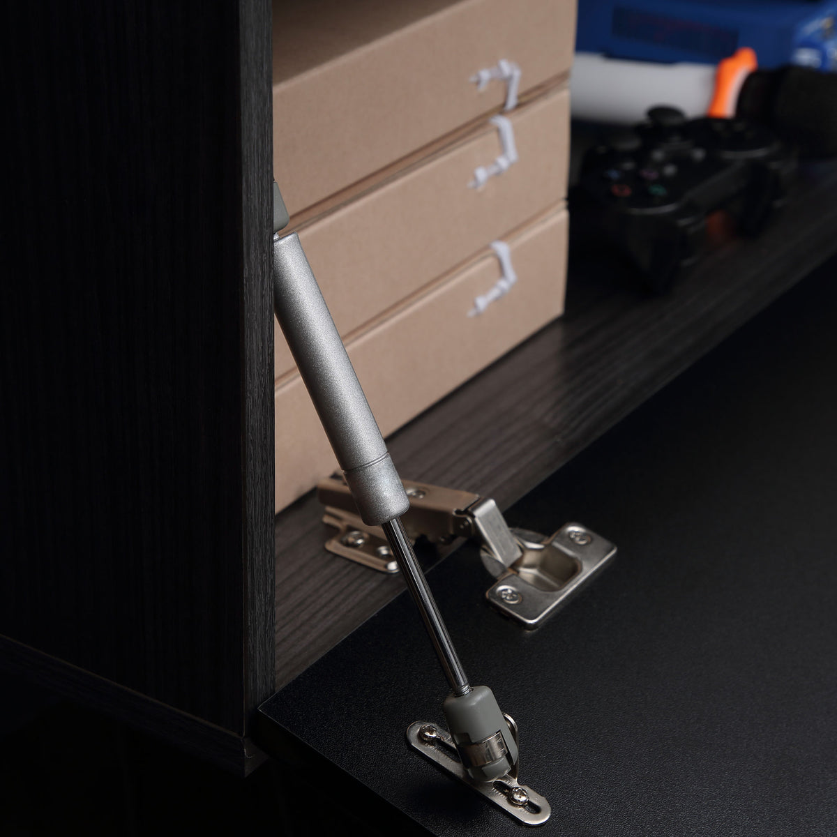 HOMCOM TV cabinet interior with metal hinge and door support arm