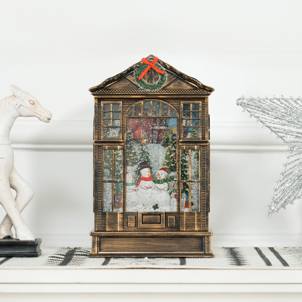 Christmas snow globe lantern with snowy tree and snowmen scene