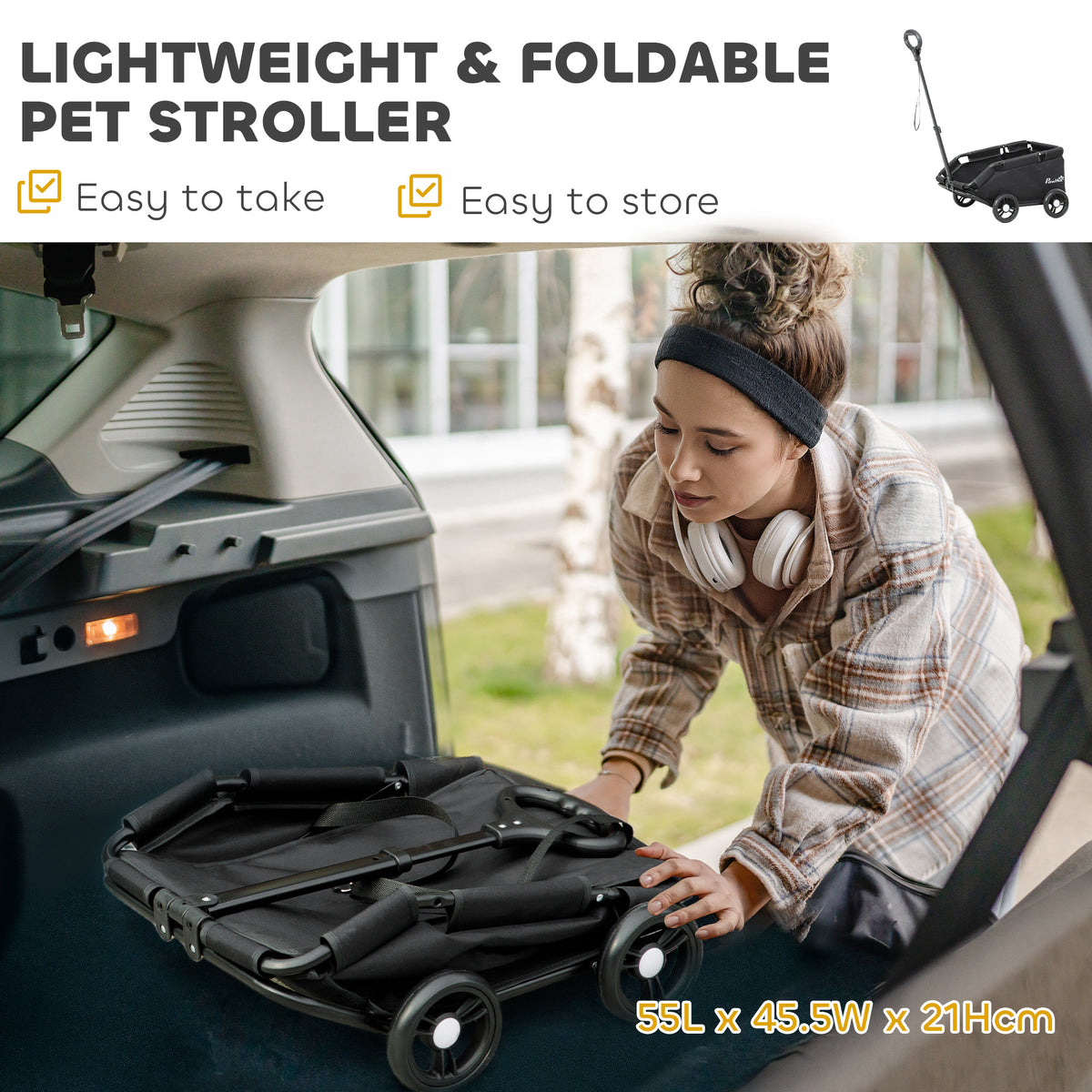 Folded black pet wagon with four wheels, shown being loaded into a car trunk.