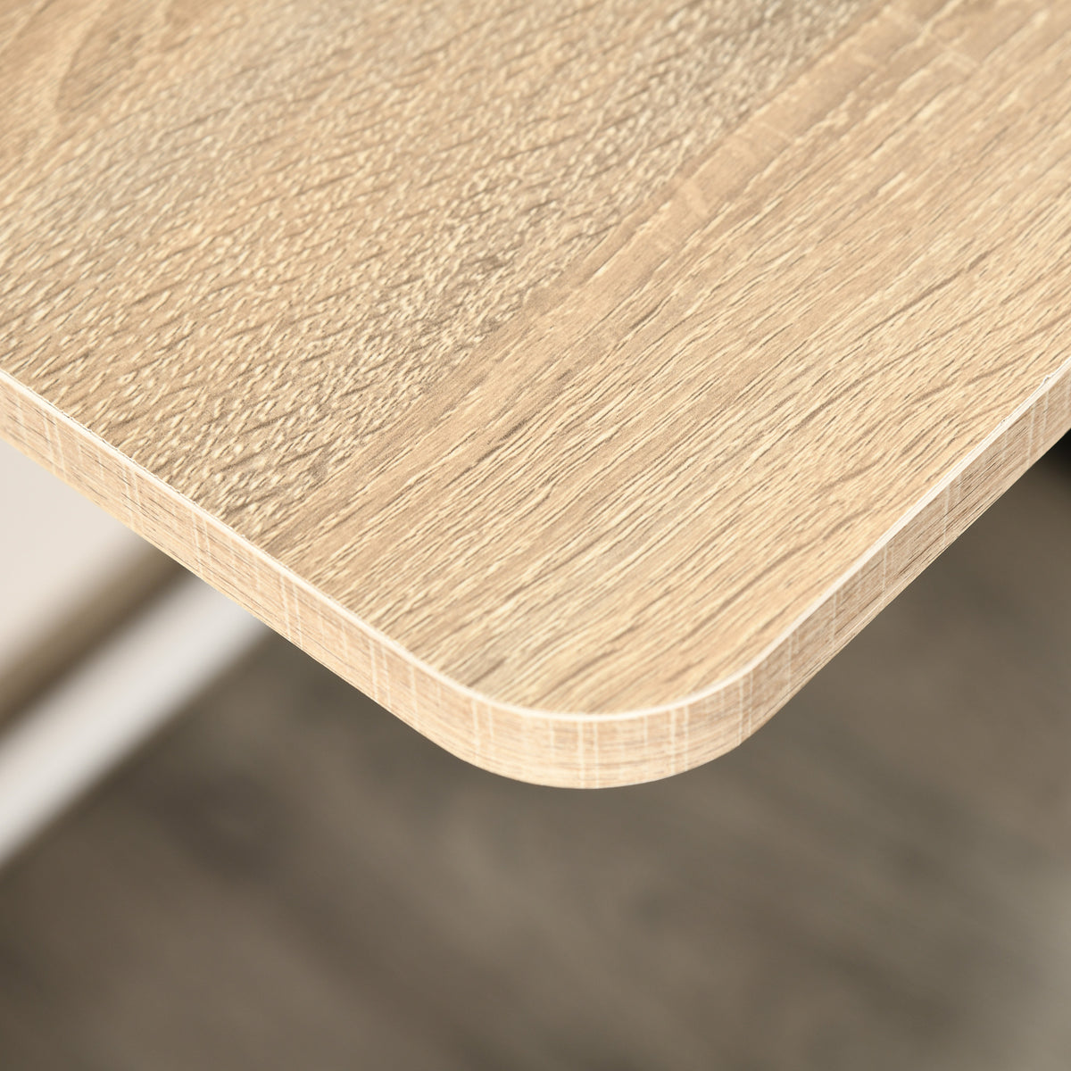 Close-up of the oak-look desktop's rounded edge
