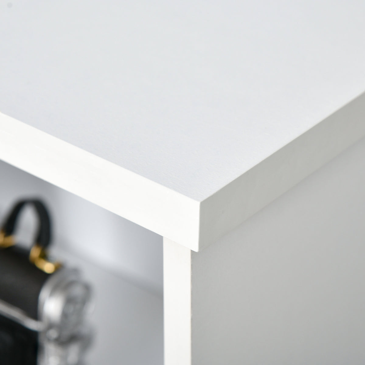 White bookcase detail showing the top panel and side edge
