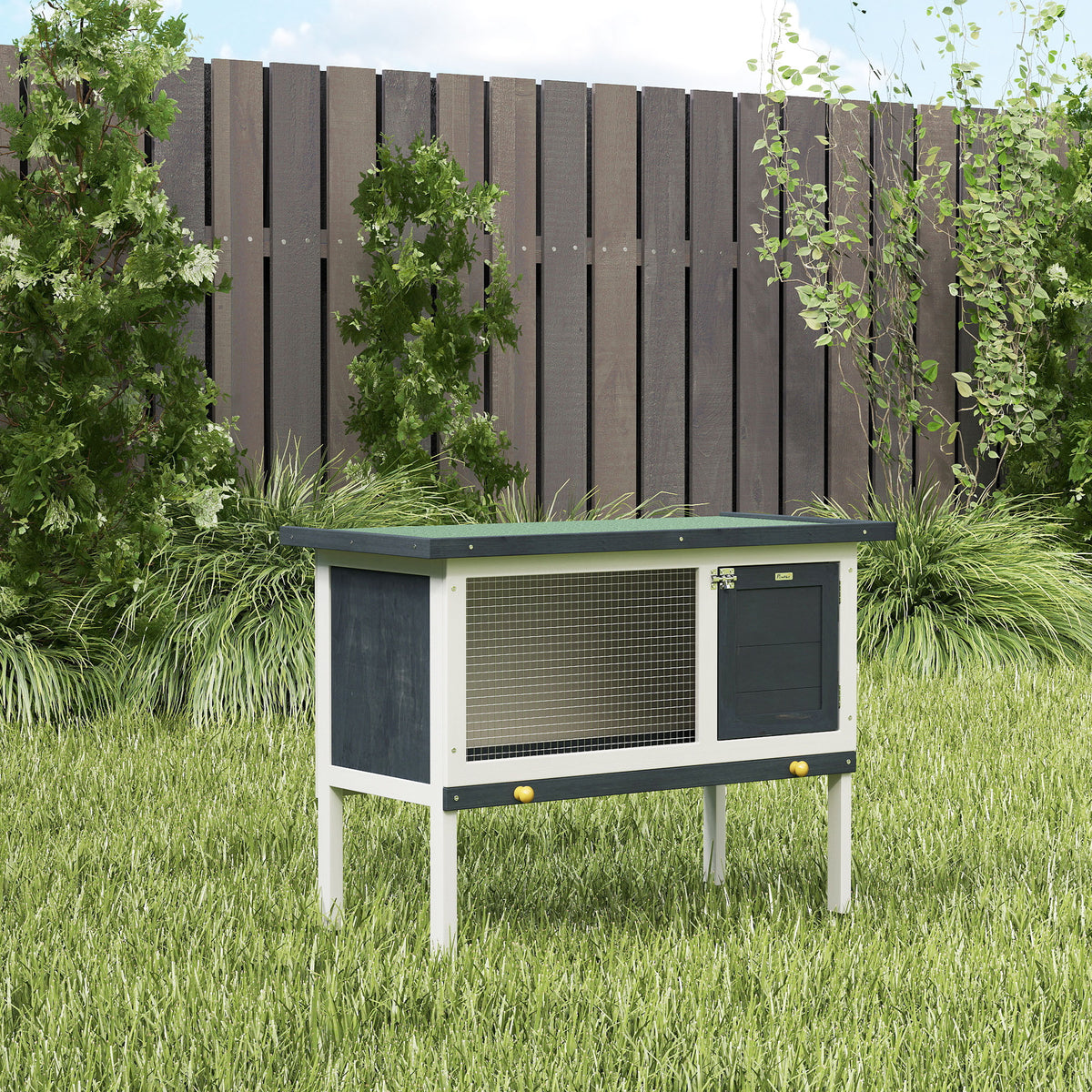 PawHut wooden rabbit hutch with raised legs, mesh window, lockable door and green roof