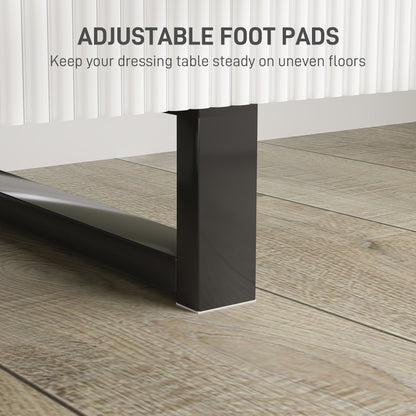 Close-up of a black vanity desk leg with an adjustable foot pad.