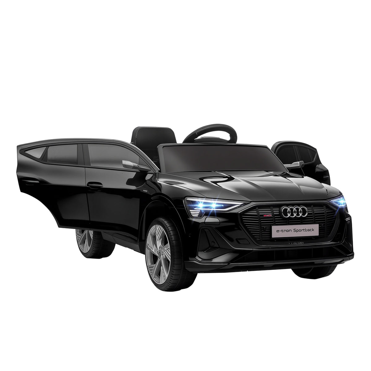 Black Audi e-tron kids' electric ride-on car with doors open and illuminated headlights.