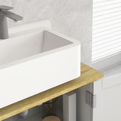 Close-up of the wood-look cabinet top beneath a basin, with the cabinet hinge visible