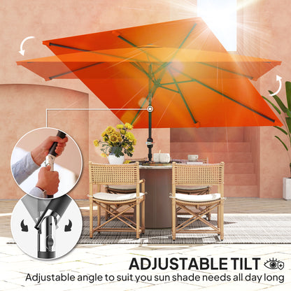 Orange patio parasol tilted over a dining set, with adjustable angle controls