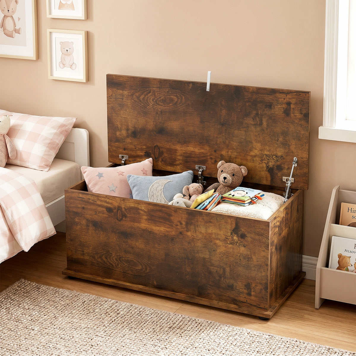 Open rustic brown storage chest holding pillows, books and stuffed toys
