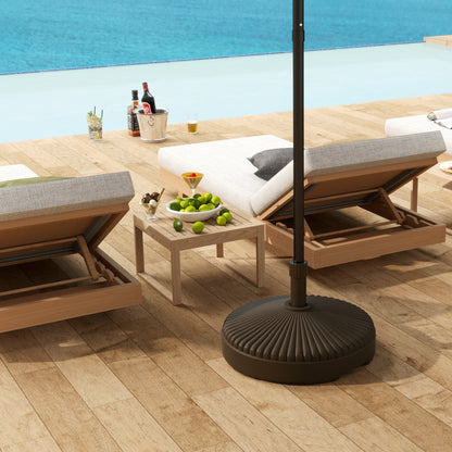 Outsunny brown ribbed umbrella base anchoring a patio umbrella beside loungers