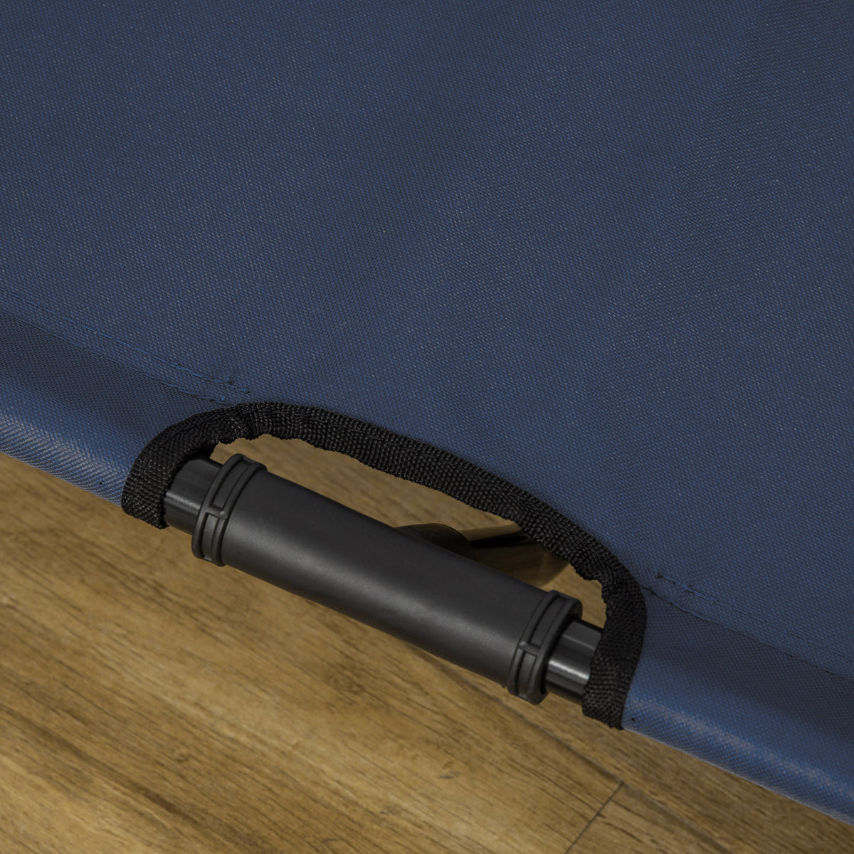 Close-up of the blue bed fabric secured around a black metal frame tube