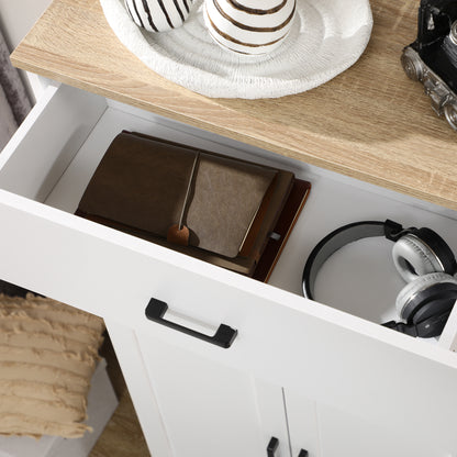 Open cabinet drawer with black handle and wood-look countertop