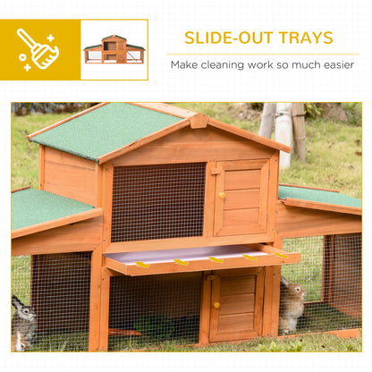 PawHut rabbit hutch with slide-out cleaning trays shown beneath the upper enclosure