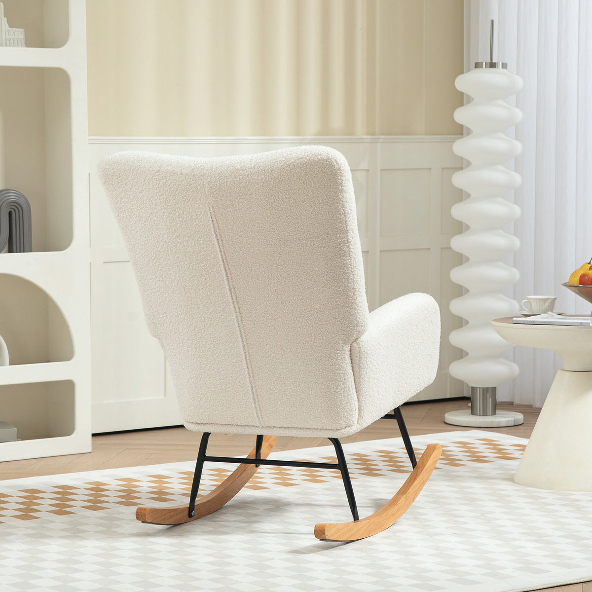 Rear view of cream teddy fleece rocking chair with black frame and wooden runners