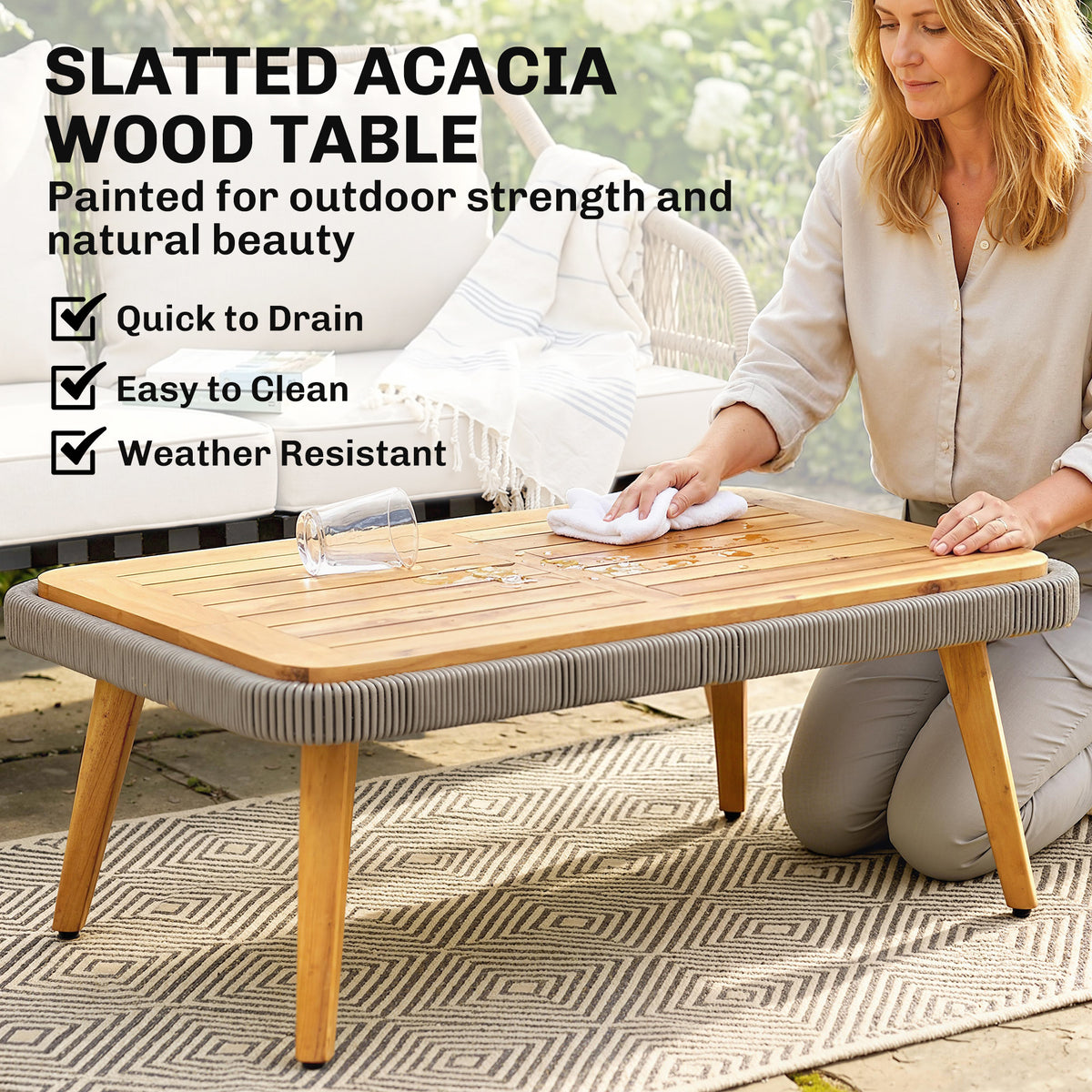 Slatted acacia wood patio table with a gray woven rattan edge
