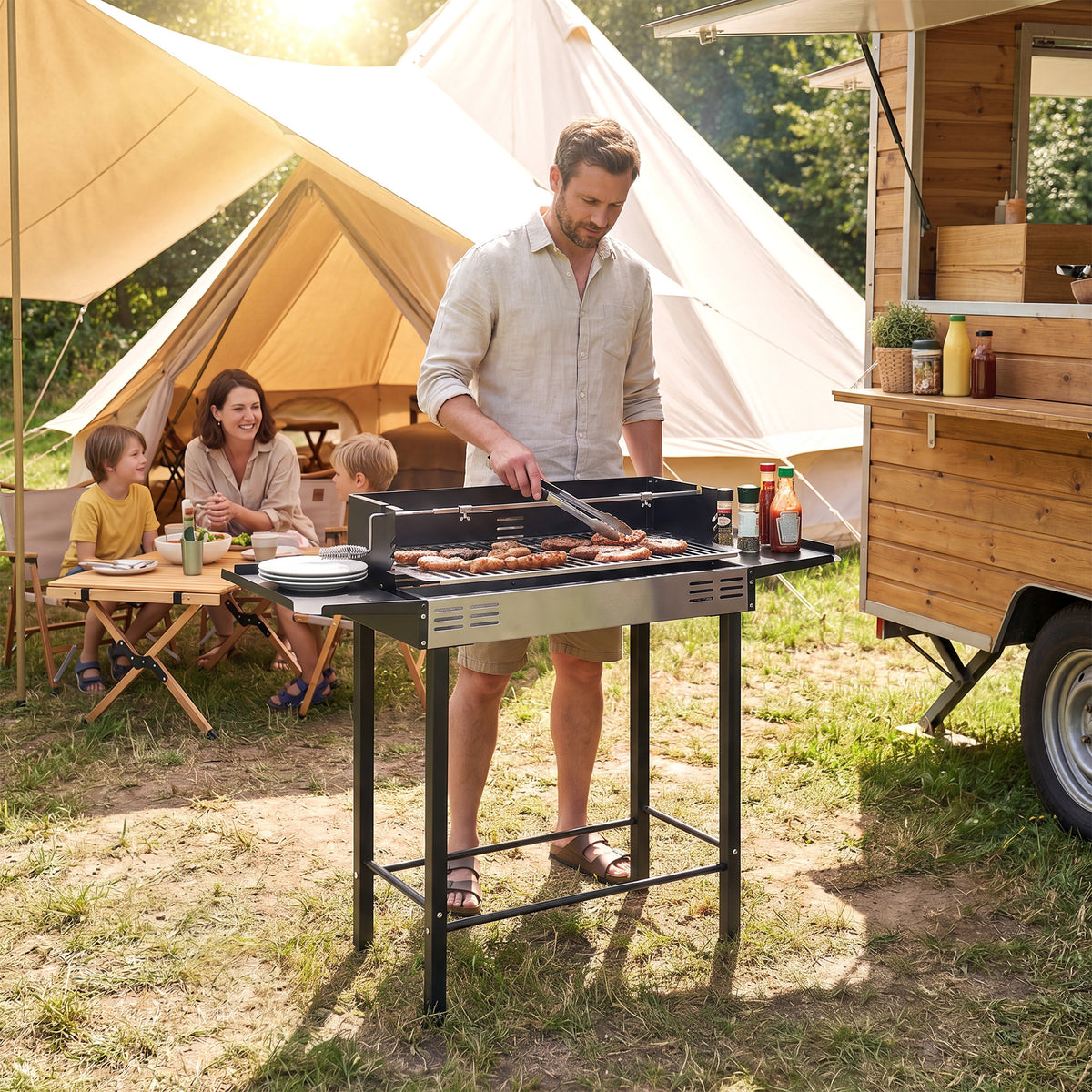 Outsunny charcoal rotisserie grill with side shelves in use at a campsite
