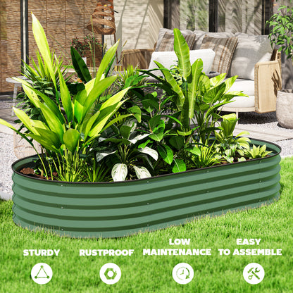 Green ribbed steel planter filled with leafy plants