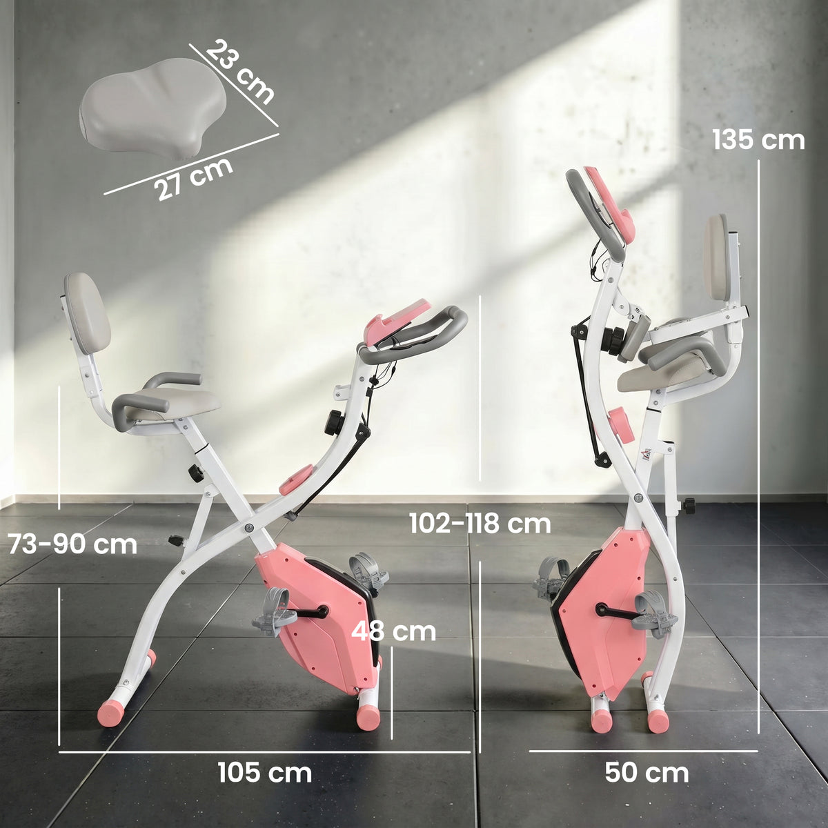 Pink and white folding exercise bike shown from side and front with size measurements.