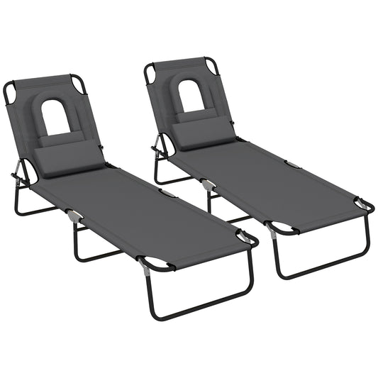 Photo of Outsunny Folding Sun Loungers Set of 2 with Face Hole, 4-Position Adjustable Backrest Garden Recliner Chair Sunbed, Outdoor Lounge Chair with 500 D Oxford Cloth Seat, Pillow for Beach, Dark Grey in Grey colour on a white background