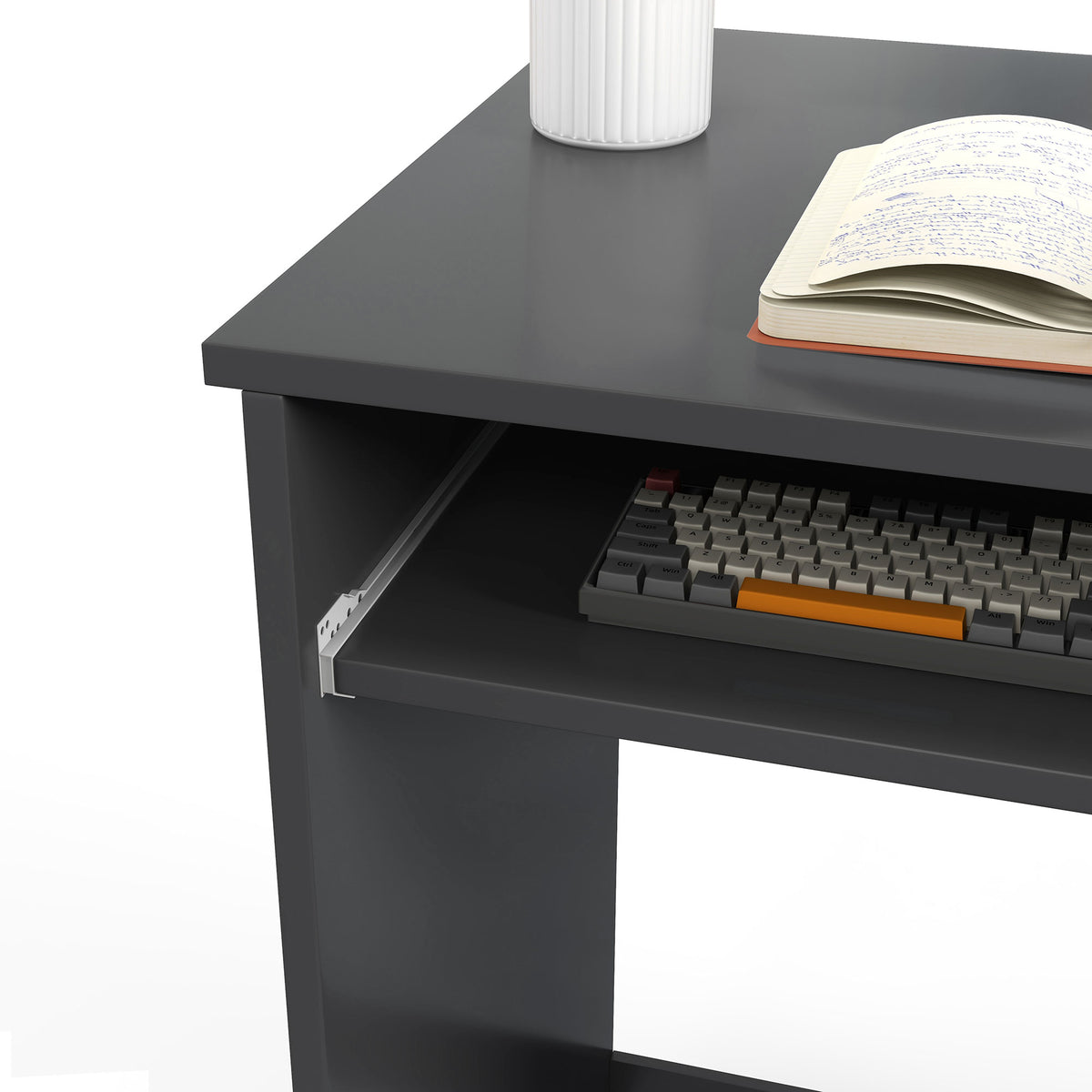 Close-up of the grey desk's sliding keyboard tray and tabletop.