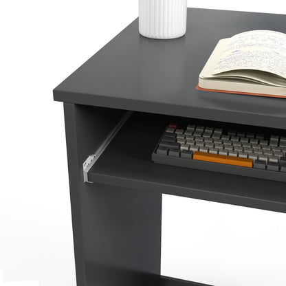 Close-up of the grey desk's sliding keyboard tray and tabletop.
