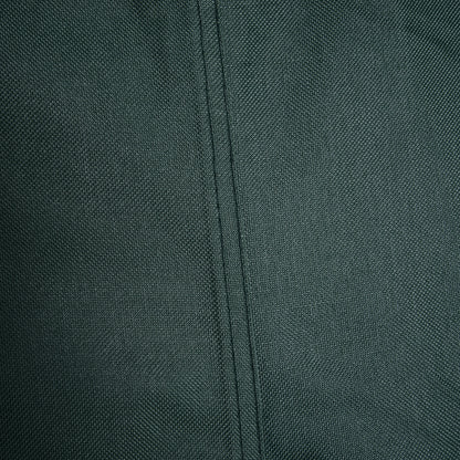 Close-up of the green cover's woven fabric and stitched seam