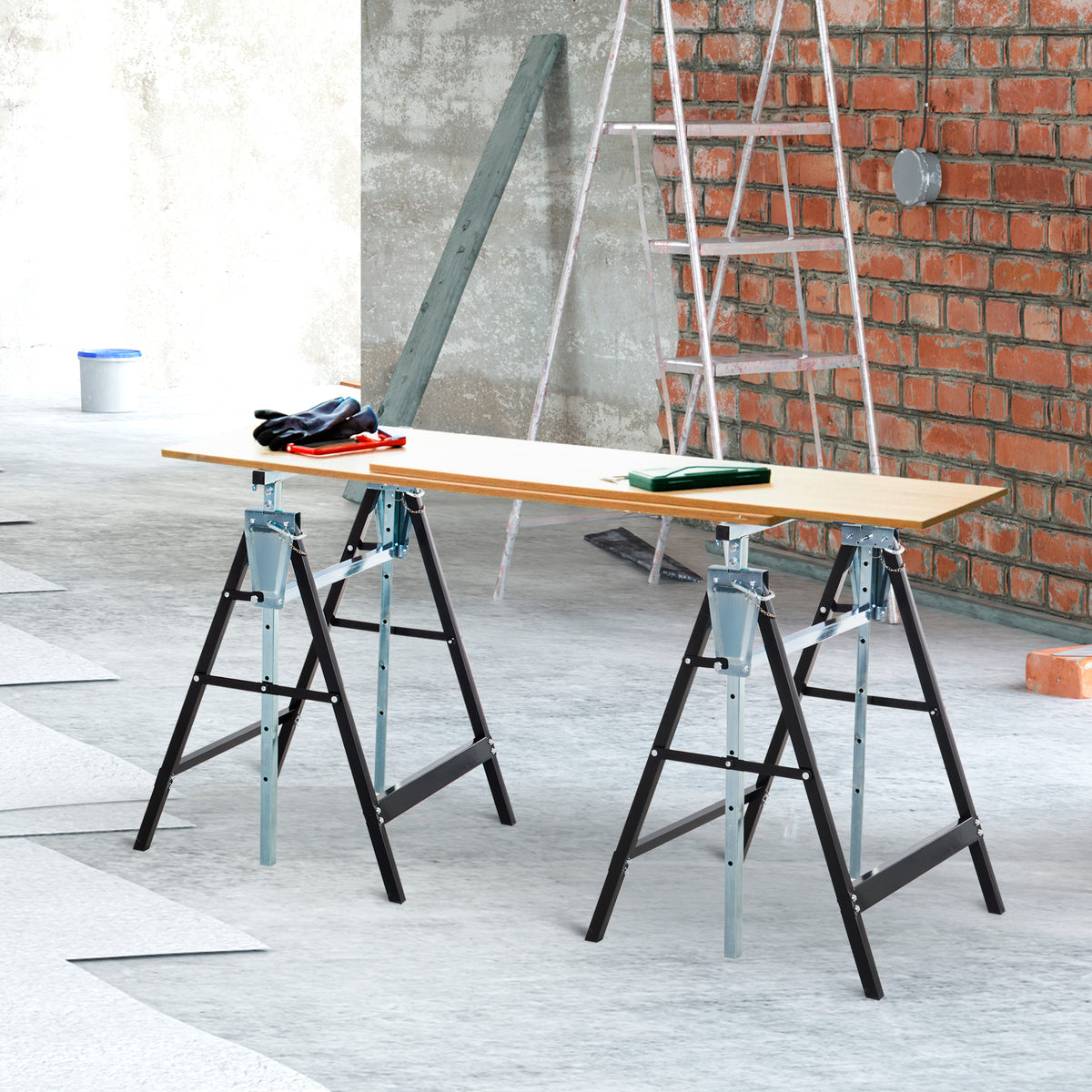 Pair of steel trestles supporting a long work surface