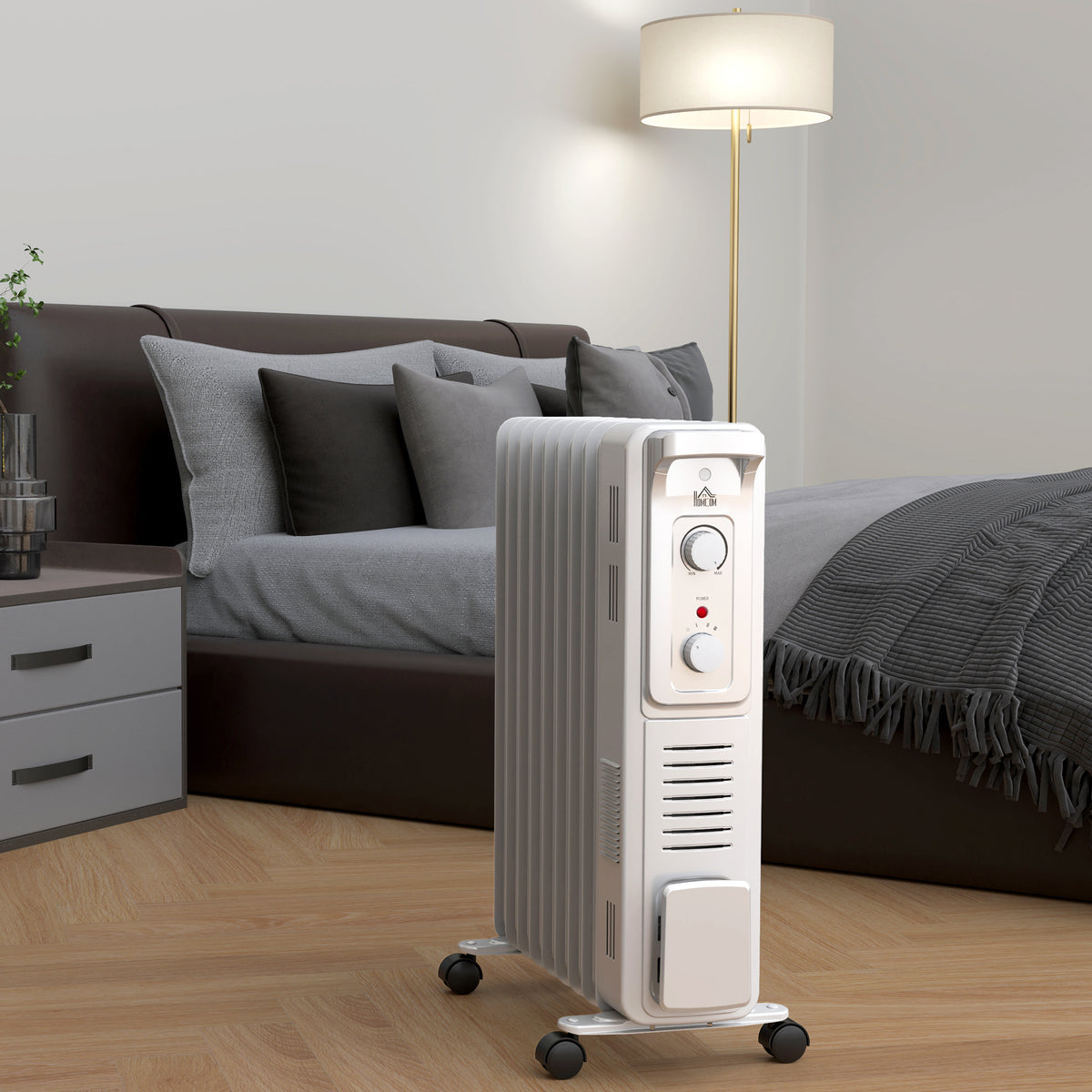 White HOMCOM oil-filled radiator with nine fins, control knobs, and caster wheels