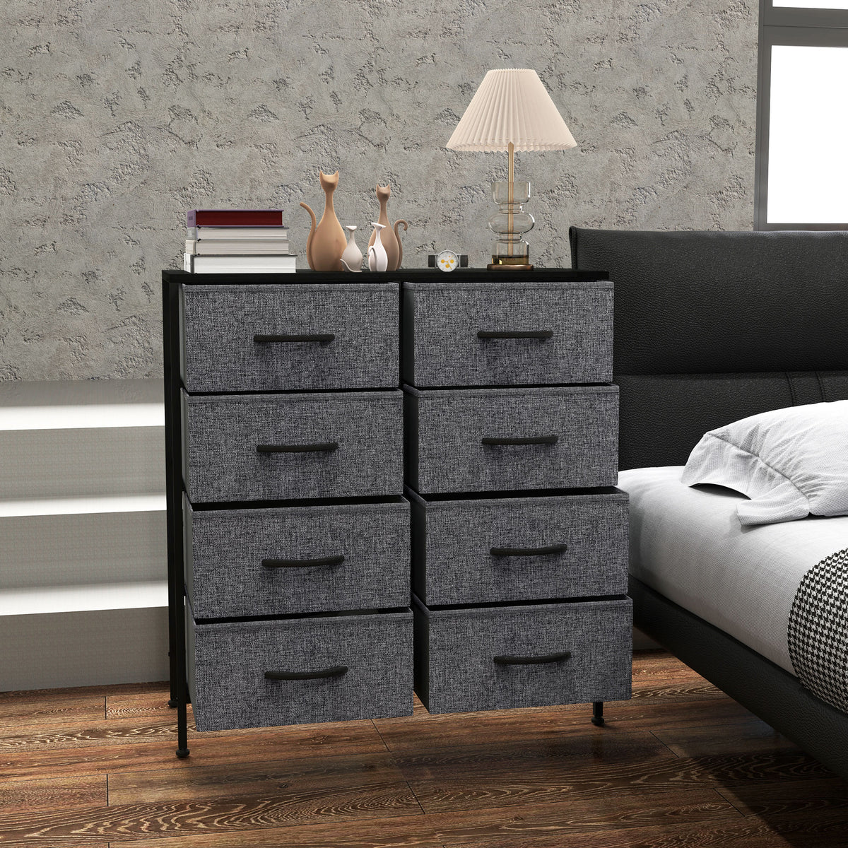 Front view of a fabric chest with eight gray drawers and black metal frame