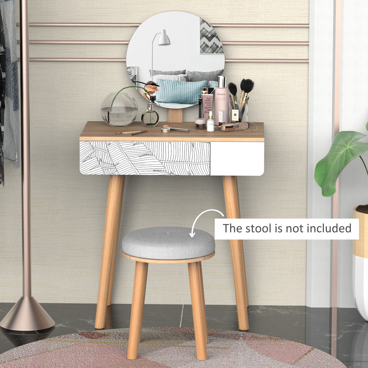 Oak-finish dressing table with round mirror, patterned drawer, and tapered legs.