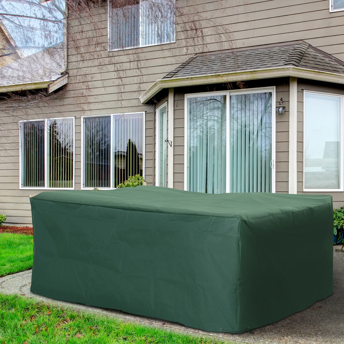 Green outdoor furniture cover fitted over a rectangular patio set