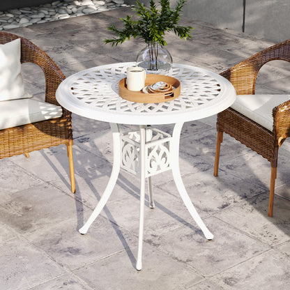 White garden table with a circular lattice top and decorative central base