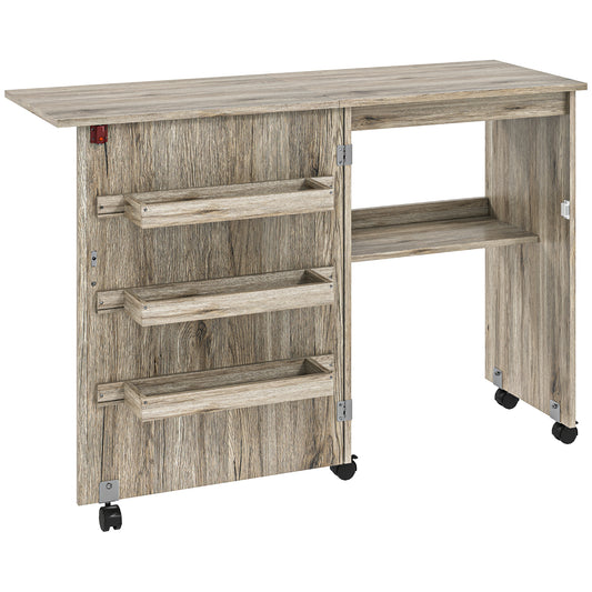 Photo of HOMCOM Folding Sewing Table, Drop Leaf Craft Table with Storage Bins, Open Shelf and Wheels, Rolling Sewing Machine Cabinet Computer Desk for Small Space, Grey in Grey colour on a white background