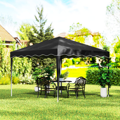 Black pop-up gazebo with a peaked canopy sheltering outdoor seating