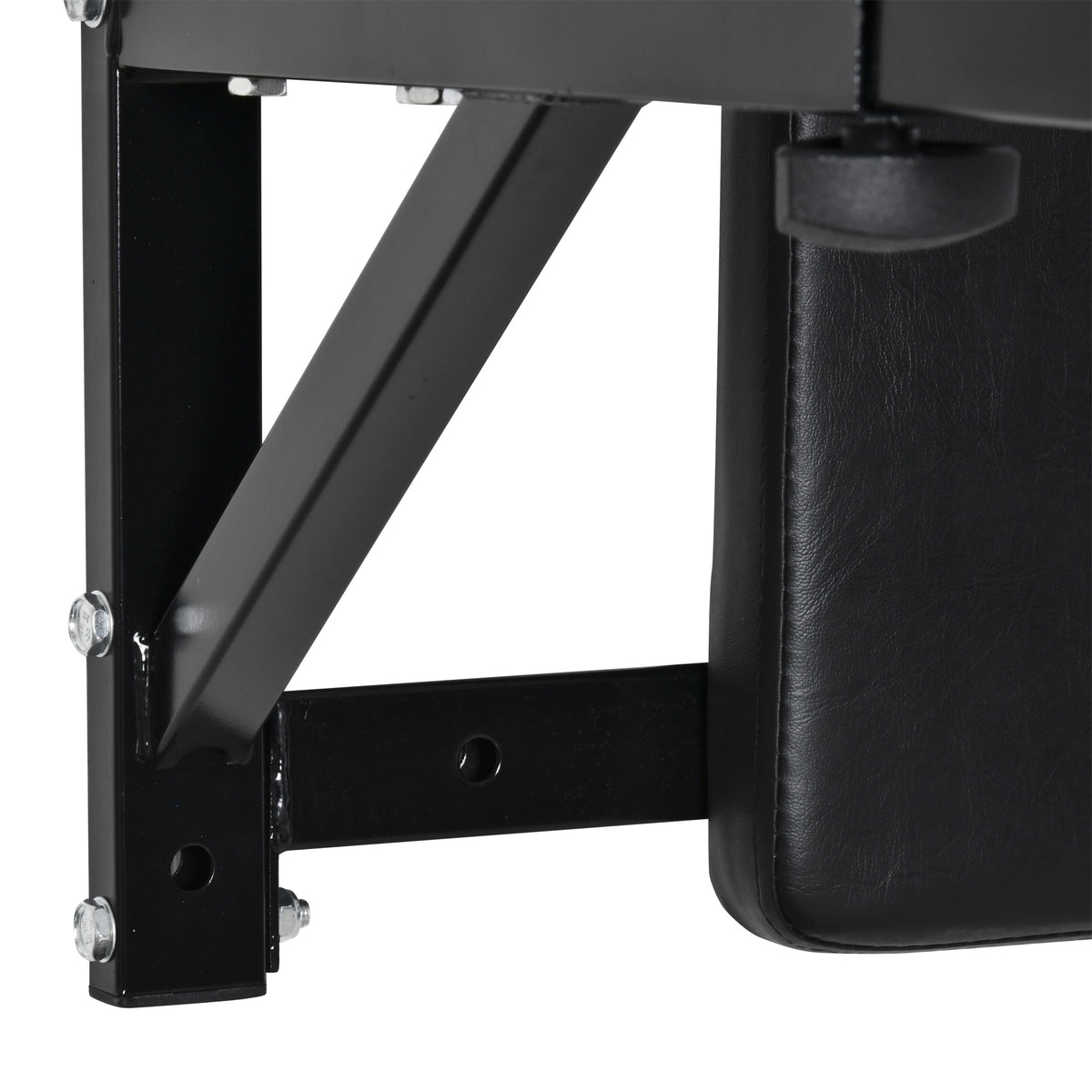 Close-up of the dip station's black steel support brace, mounting holes and padded backrest