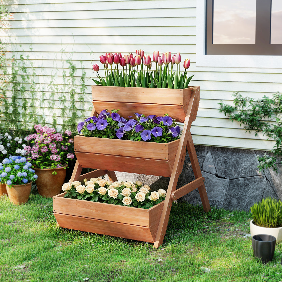 Outsunny brown wooden tiered planter filled with tulips, purple flowers, and roses