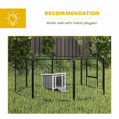 PawHut rabbit hutch placed inside a black metal playpen