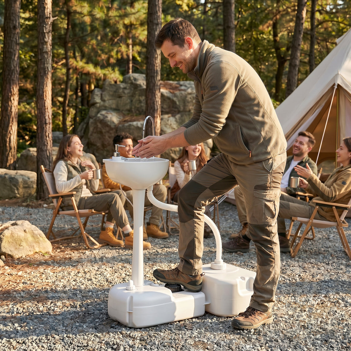 Outsunny portable camping sink being operated by foot pump at an outdoor gathering