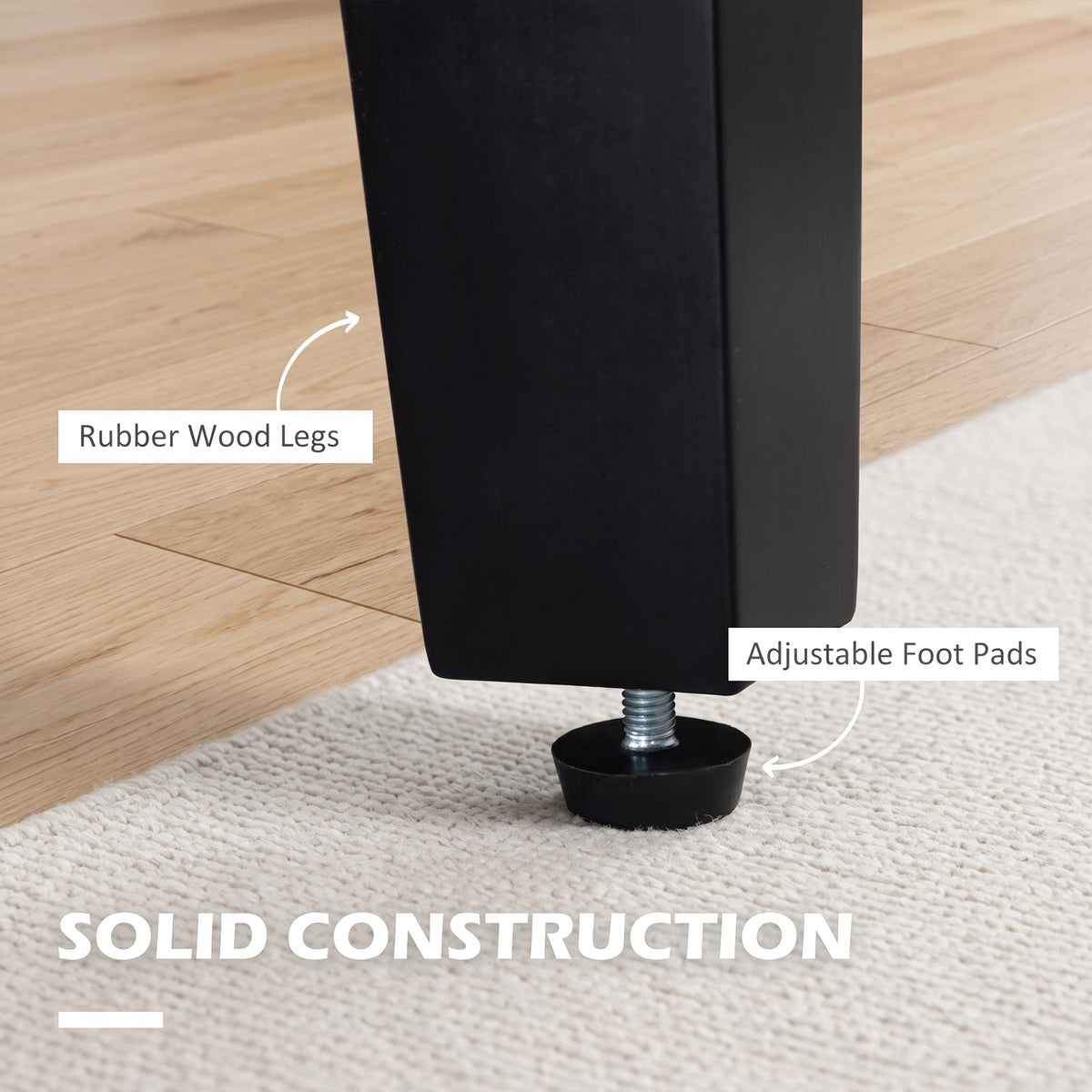 Armchair leg close-up showing a black rubber wood leg and adjustable foot pad