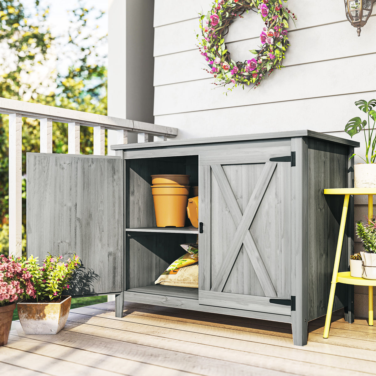 Outsunny wooden garden shed shown open with two interior storage shelves