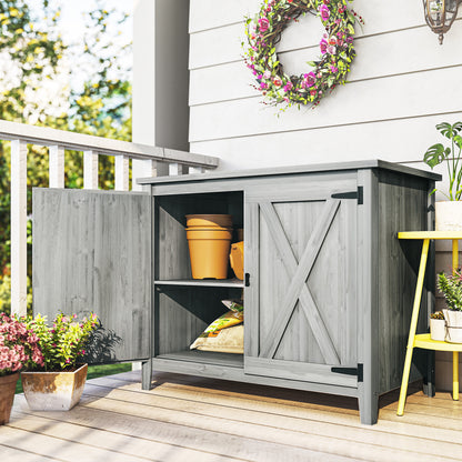 Outsunny wooden garden shed shown open with two interior storage shelves