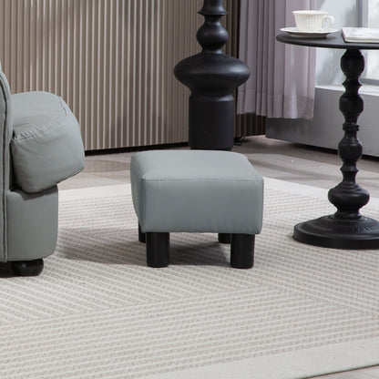 Grey PU leather footstool with four black legs beside a sofa