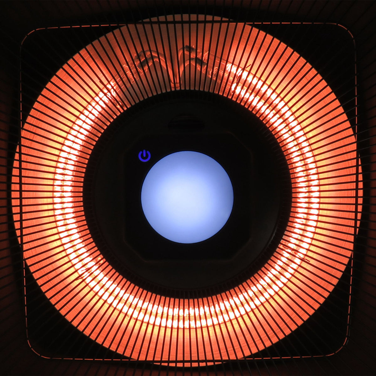Close-up of the patio heater's glowing halogen element and central LED light